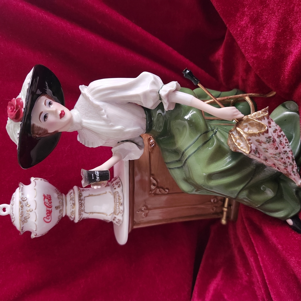 Elegant Lady Figurine with Green Skirt and Black Hat